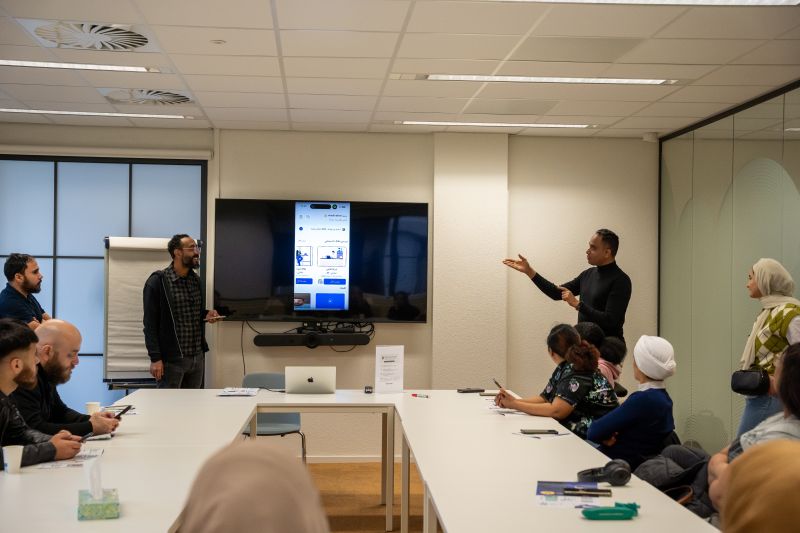 Eye-level view of a community gathering for language practice